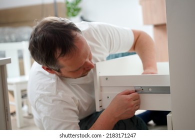 Housework, Father Fixing A Broken Shelf. Distribution Of Duties