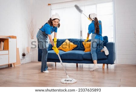Housework or house keeping service two female cleaning dust in home, cleaning agency small business. professional equipment cleaning old home.