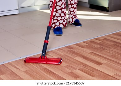 Housework With Using Flat Mop To Mopping Floor In Kitchen.