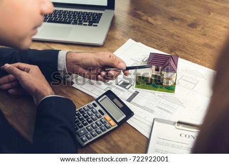 Housing developer agent explaining concept to client or architect for real estate development before making a contract