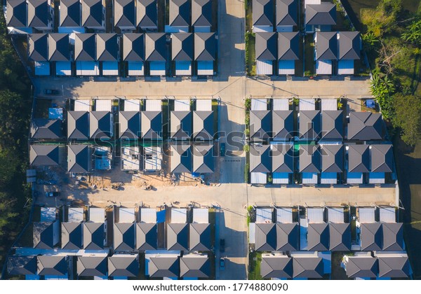 Housing subdivision or housing development.\
Also call tract housing. Large tract of land that divided into\
smaller. Business process by developer and builder. Aerial view in\
Chiang Mai of Thailand.