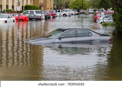Houston, Texas - August 27, 2017: Cars submerged from hurricane Harvey in Houston, Texas, USA. Heavy rains from hurricane Harvey caused many flooded areas in Houston.