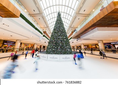 Houston, Texas - December 23, 2016: Children And Young Adults Ice Skating Around Christmas Tree In Skate Rink In Shopping Mall