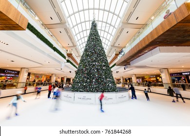 Houston, Texas - December 23, 2016: Children And Young Adults Ice Skating Around Christmas Tree In Skate Rink In Shopping Mall