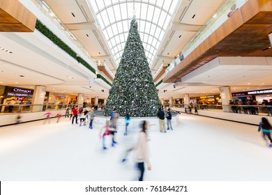 Houston, Texas - December 23, 2016: Children And Young Adults Ice Skating Around Christmas Tree In Skate Rink In Shopping Mall