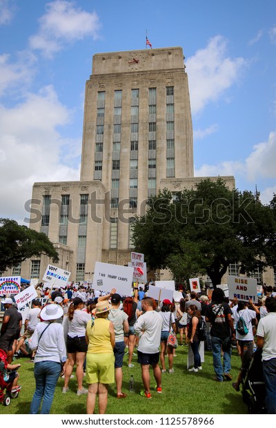 Houston, Texas - June 30, 2018: Hundreds of\
people gather at Houston’s City Hall to protest the Trump\
administration’s zero-tolerance immigration policy, which has\
divided parents from their\
children.