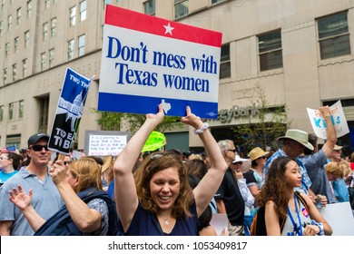 Houston, Texas - March 24, 2018: Woman holds a sign that reads "Don't Mess with Texas Women" in March For Our Lives rally