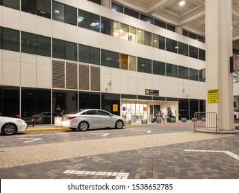 Houston, Texas, United States - October 18, 2019: Houston George Bush Intercontinental Airport Terminal B Arrival Passenger Pickup For Private Cars At Friday Night 