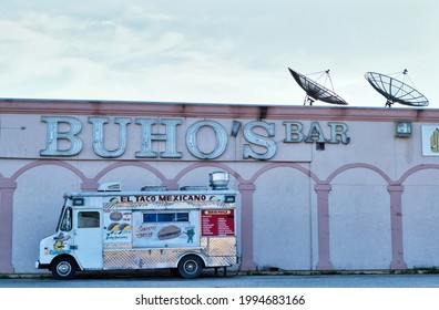 Houston, Texas USA 06-03-2021: Buho's Bar Exterior With A Taco Truck Out Front In Houston, TX. Adult Entertainment Nightclub.