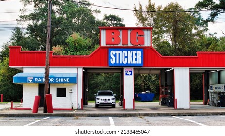 Houston, Texas USA 11-12-2021: Big Sticker Front Street Side Exterior View In Houston, TX. Smog Check Inspection Station, Family Owned Business.