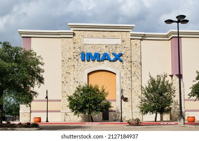 Houston, Texas USA 12-05-2021: IMAX movie theater main entrance and parking lot in Houston TX. Founded in 1967, Montreal Canada.