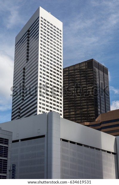 HOUSTON, TEXAS, USA - JULY 11, 2013: The\
skyscrapers of downtown Houston in the summer\
noon.