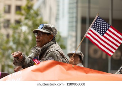 Houston, Texas, USA - November 11, 2018: The American Heroes Parade, Vietnam Veteran On A Float With The American Flag, During The Parade