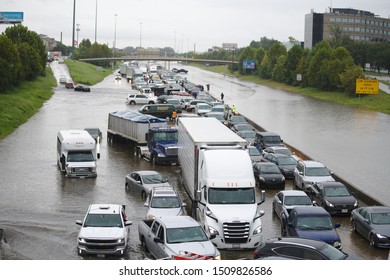 Houston, Texas / USA - September 19 2019: Tropical Storm Imelda causes closure of Interstate 10 in Houston, Texas due to high water. Many vehicles are stranded for hours in the center of the highway.