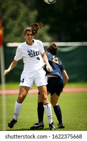 Houston, Texas/USA - August 24, 2008:  Rice University's Stephanie Crain Heads The Ball In A Game Against UTSA Played At Rice University