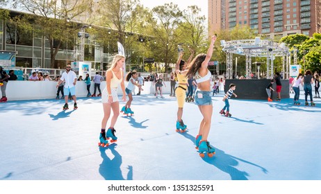 Houston, TX - March 23, 2019: Young Fit Women Roller Skating At The Rink In Discovery Green Park Houston