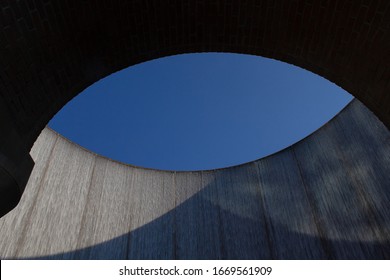 Houston, TX / USA - July 25, 2018: View Of The Top Of The Williams Tower Water Wall Through An Arch