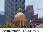 Houston TX USA - May 2020: Close-up of the cupola atop the 1910 Courthouse flanked by JP Morgan Chase Tower(1982) and the postmodern TC Energy Building (1983).