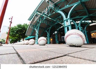 HOUSTON, TX, USA - SEPTEMBER 10, 2018: Oversized baseball's sit outside of Minute Maid Stadium, home to the MLB's Houston Astro's. These baseball's sit at most of the entrances to this sports stadium.