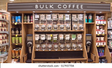 HOUSTON, US - NOV 14, 2016: Row of variety organic raw coffee beans in vending machine at Whole Foods store. Bulk coffee container, grinder to grind whole beans before brewing. Panorama style