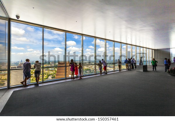 HOUSTON, USA - JULY 11: people enjoy the scenic view\
from JPMorgan Chase tower on July 11, 2013 in Houston, USA. The\
visitor platform is open to public during office hours without\
entrance fee.