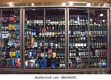HOUSTON,US-SEPT 19,2016:Various bottles of craft, microbrew, IPA, domestic and imported beers from around the world on shelf display in supermarket cooler.Alcohol drink background,different beer style