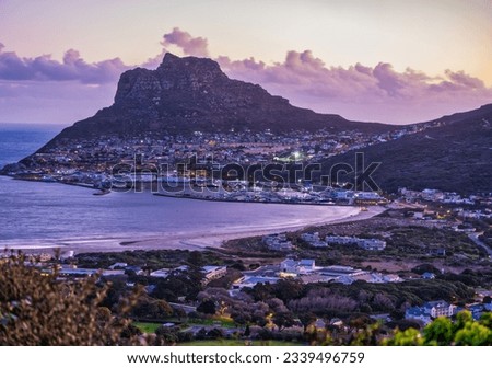 Hout Bay beachfront, harbour and the fisherman town at the foothill of the mountain, Cape Town, South Africa