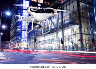 Hovering Drone Taking Pictures Of City Of London At Night