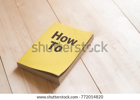 How to book or guidebook on wooden table