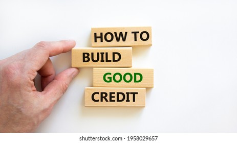 How To Build Good Credit Symbol. Wooden Blocks. Words 'how To Build Good Credit'. Beautiful White Background, Businessman Hand. Business And Build Good Credit Concept.