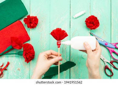 How To Make A Carnation Flower At Home. Hands Make A Red Carnation. Step-by-step Instruction. DIY Children's Art Project.