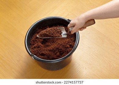 How to make cheap and eco-friendly soil from coco coir bricks, step 5: break up any left chunks with a trowel and use for potting or gardening.