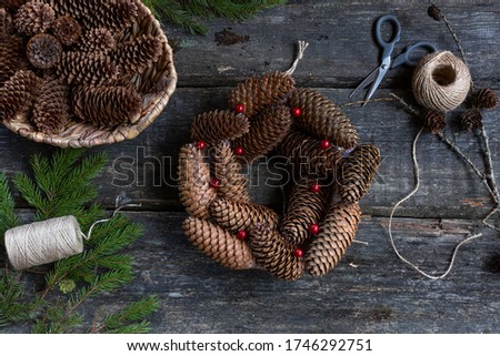 How to make Christmas wreath at home. Step by step photo instruction. Step 15. finish decorating berryes. DIY art project