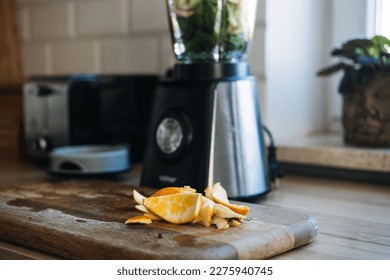 How manage food waste at home, ways reduce food waste in kitchen. Fruit and vegetable leftovers after making smoothies in home kitchen - Powered by Shutterstock