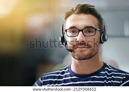How may I direct your call. Cropped portrait of a businessman wearing a headset.