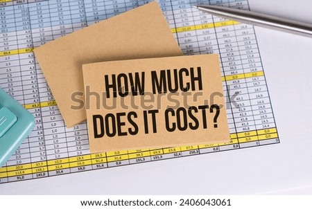 How much does it cost text on a notepad with a spring near a sticker with text