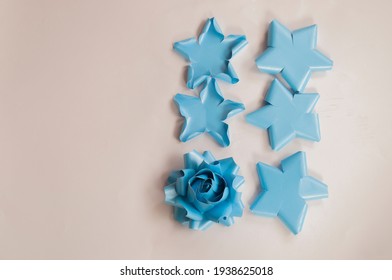 How To Paper Flower For Make Origami Rose And Leaves, Handmaed  Romantic Bouquet For Valentine, Wedding, Card, And Decorate Backdrop. Focus Blue Rose Paper On The White Background.