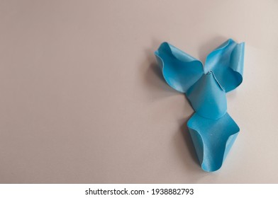 How To Paper Flower For Make Origami Rose And Leaves, Handmaed  Romantic Bouquet For Valentine, Wedding, Card, And Decorate Backdrop. Focus Blue Rose Paper On The White Background.