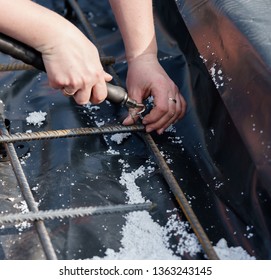 How to Tie Rebar, manual reinforcement of the foundation grid - Shutterstock ID 1363243145