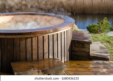 How Water Swirling In Wooden Hot Tub Outside In Nature. Enjoying Hot Steaming Pool On A Sunny Day, Private Spa Treatment. Nobody