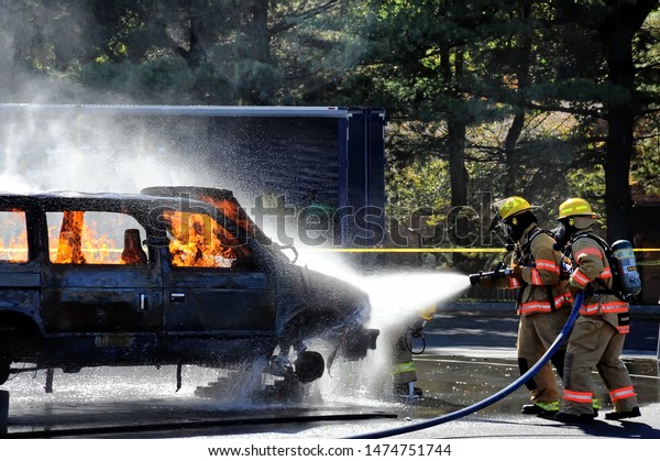 HOWARD COUNTY, MARYLAND - OCTOBER 19, 2008: Fire\
and rescue workers demonstrating firefighting techniques at the\
fire department\'s open\
house.