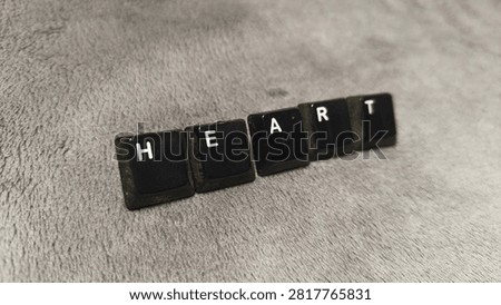 However, in this composition, the individual keycaps are no longer in a strict linear or sequential arrangement. They are slightly scattered or 