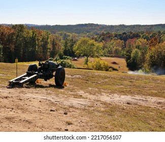 Howitzer Cannon Overlooking A Smoky Field