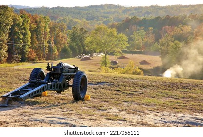 Howitzer Cannon Overlooking A Smoky Field