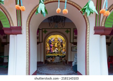 Howrah, India -October 26th, 2020 : Hindu Purohit Worshipping Goddess Durga Inside Old Age Decorated Home. Durga Puja, Biggest Festival Of Hinduism, UNESCO Intangible Cultural Heritage Of Humanity.