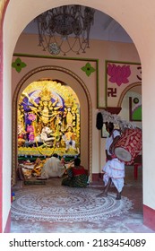 Howrah, India -October 26th, 2020 : Dhaaki Playing Dhaak Decorated With Kaash Ful, Inside Old Age Decorated Home. Durga Puja, Biggest Festival Of Hinduism, UNESCO Cultural Heritage Of Humanity.