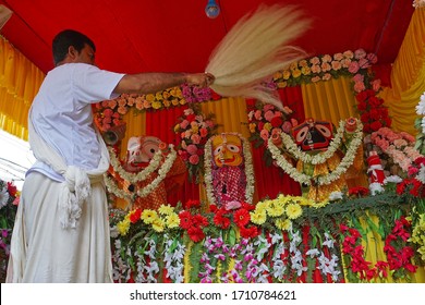 Howrah, West Bengal, India - 7th July 2019 : Hindu priest worshipping idol of God Jagannath, Balaram and Suvodra. Ratha jatra festival is famous Hindu festival in India.