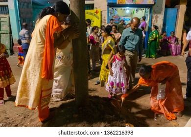 HOWRAH,WEST BENGAL, INDIA - APRIL 15TH, 2018 : Women Praying To Wood - During Gajan And Charak Puja-a Hindu Festival. Lord Shiva, Neel And Dharmathakur Are Worshipped. Ends Before Bengali New Year.