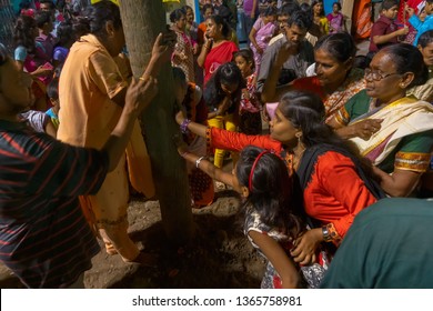 HOWRAH,WEST BENGAL, INDIA - APRIL 15TH, 2018 : Women Praying To Wood - During Gajan And Charak Puja-a Hindu Festival. Lord Shiva, Neel And Dharmathakur Are Worshipped. Ends Before Bengali New Year.