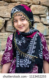 HOWRAMAN-TAKHT, IRAN - MAY 23, 2018: A Kurdish girl wearing traditional hijab and dress, which are typical of the Howraman Valley, Kurdistan.
